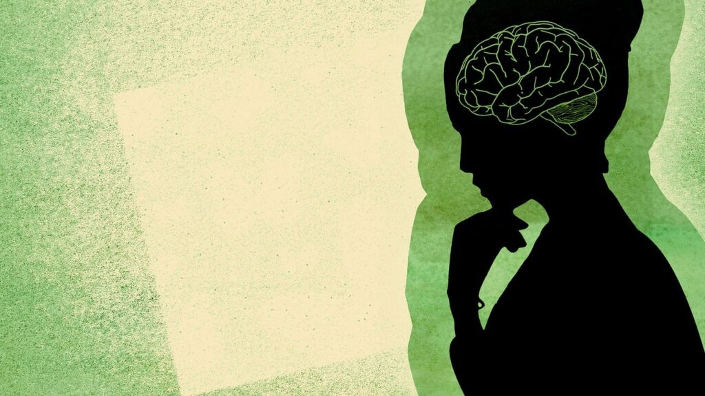 Illustration of an all-black single-tone woman. No features are visible. The subject's brain is illustrated in bright green.