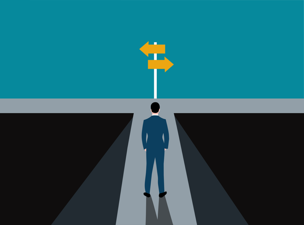 Illustration of a man at a crossroads. He is wearing a blue suit with black shoes. There is a street sign with two yellow arrows pointing in different directions down the road.